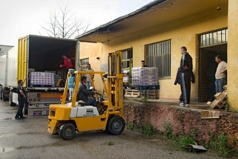 Loading of relief supplies in the storehouse at Pogradec